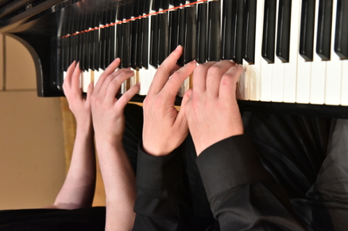 Students Playing the Piano
