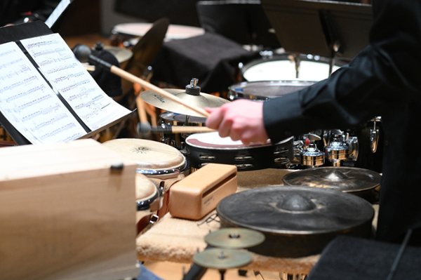 hands near percussion instruments