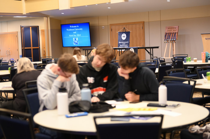 High School Students Solve Math Equations During Math Day 2024