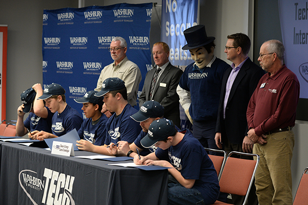 Students sign letters of intent.