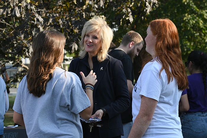 President Mazachek talks with a group of students.
