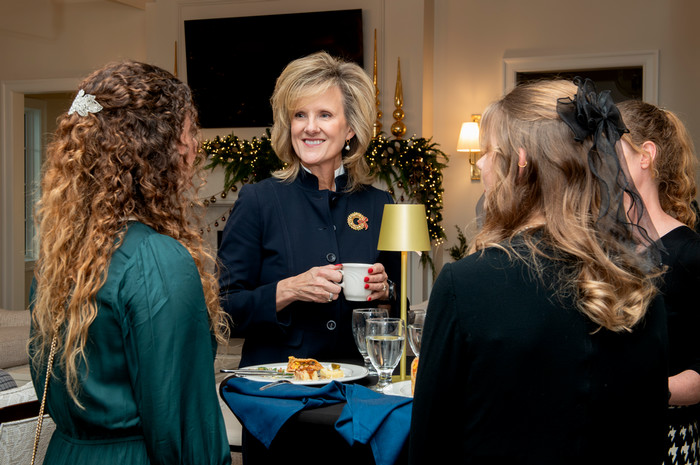 President Mazachek with Students in the Ross House