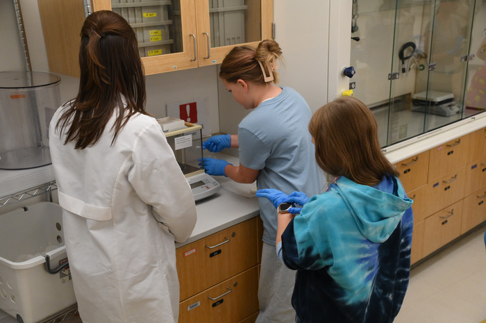 Student in a lab during Women in Science Day 2024