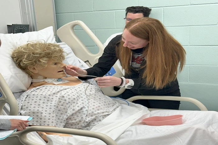 School of Nursing students practicing in lab