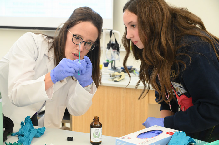 Student in a lab during Women in Science Day 2025