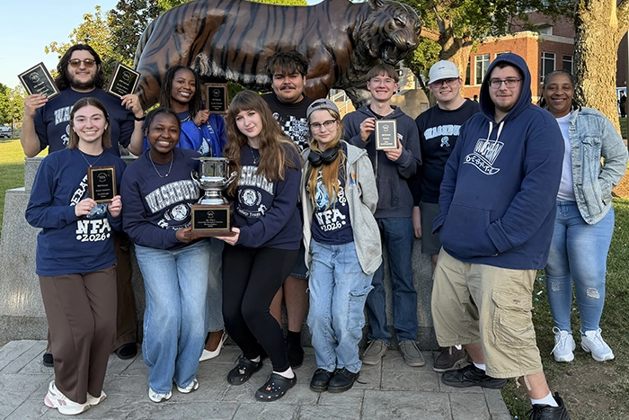Washburn Debate participants pose with their awards.