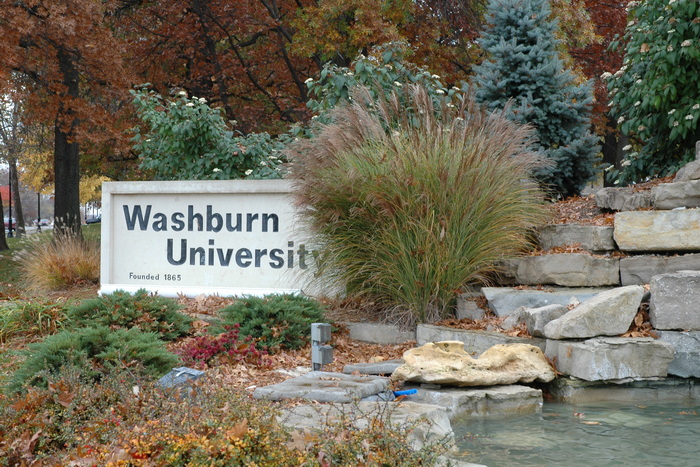 Stone Washburn University sign with waterfall